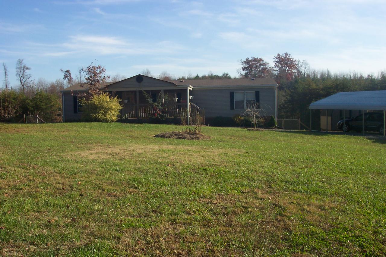 1336 Rockcreek Road Sandy Level, VA 24161 - Photo 5 of 19 a view of a house with a yard and a garage