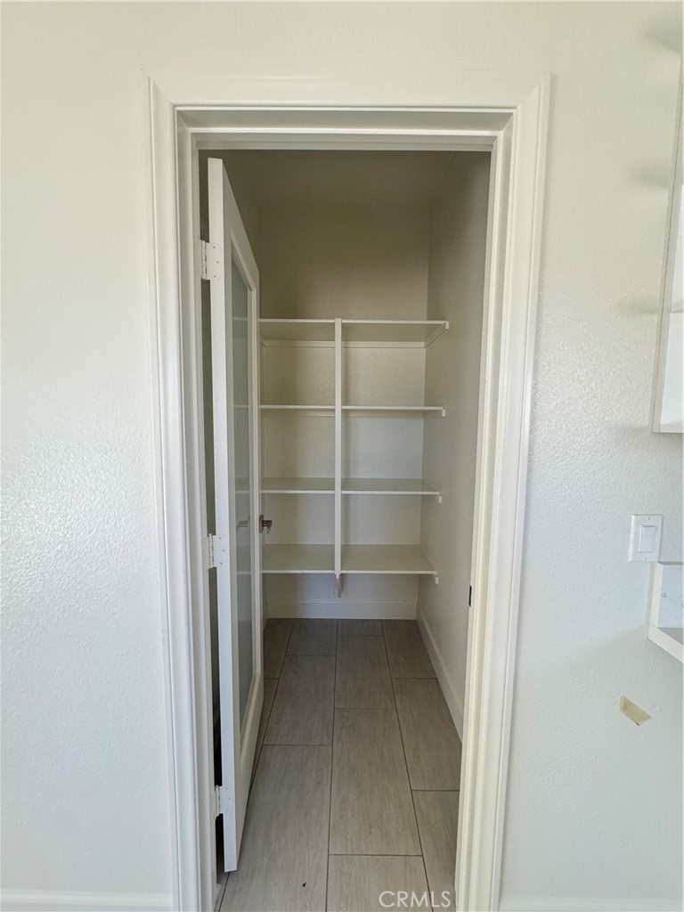 191 East O Street Colton, CA 92324 - Photo 11 of 27 a view of a room with rack on the wall