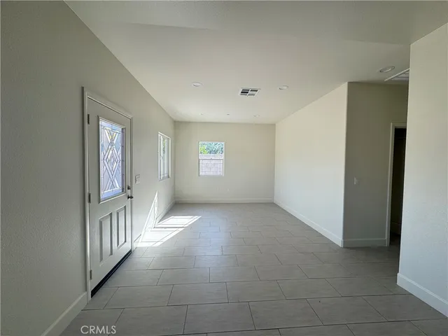 a view of an empty room and window