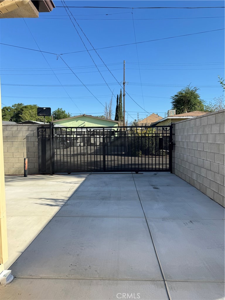 191 East O Street Colton, CA 92324 - Photo 16 of 27 a view of entryway with wooden fence