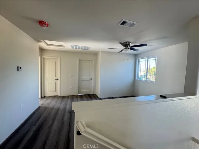 a view of an empty room and a window