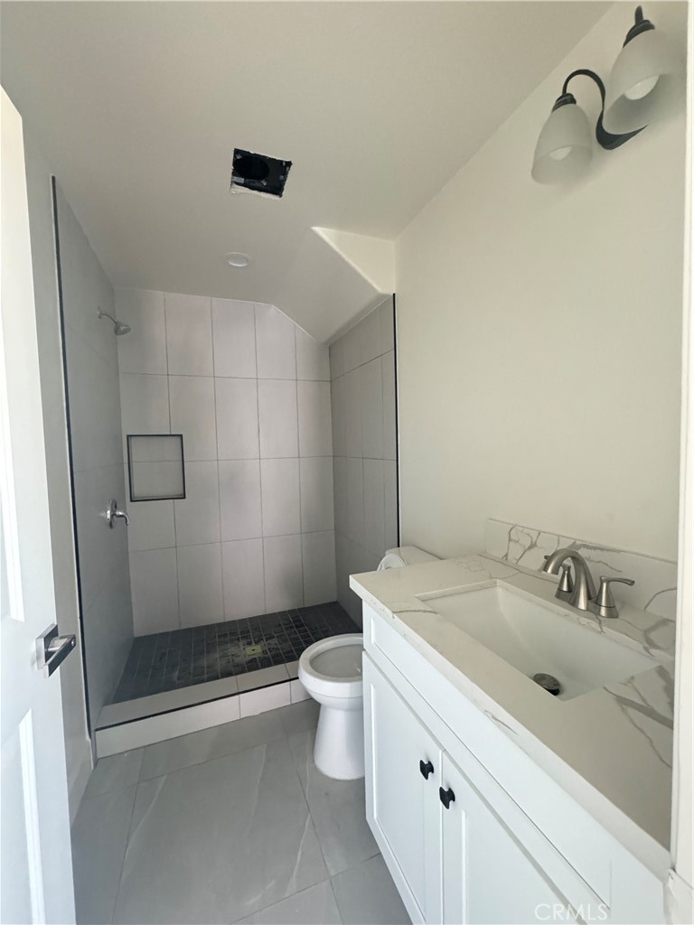 191 East O Street Colton, CA 92324 - Photo 25 of 27 a bathroom with a sink a toilet and shower