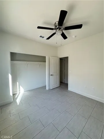 an empty room with a empty space and windows