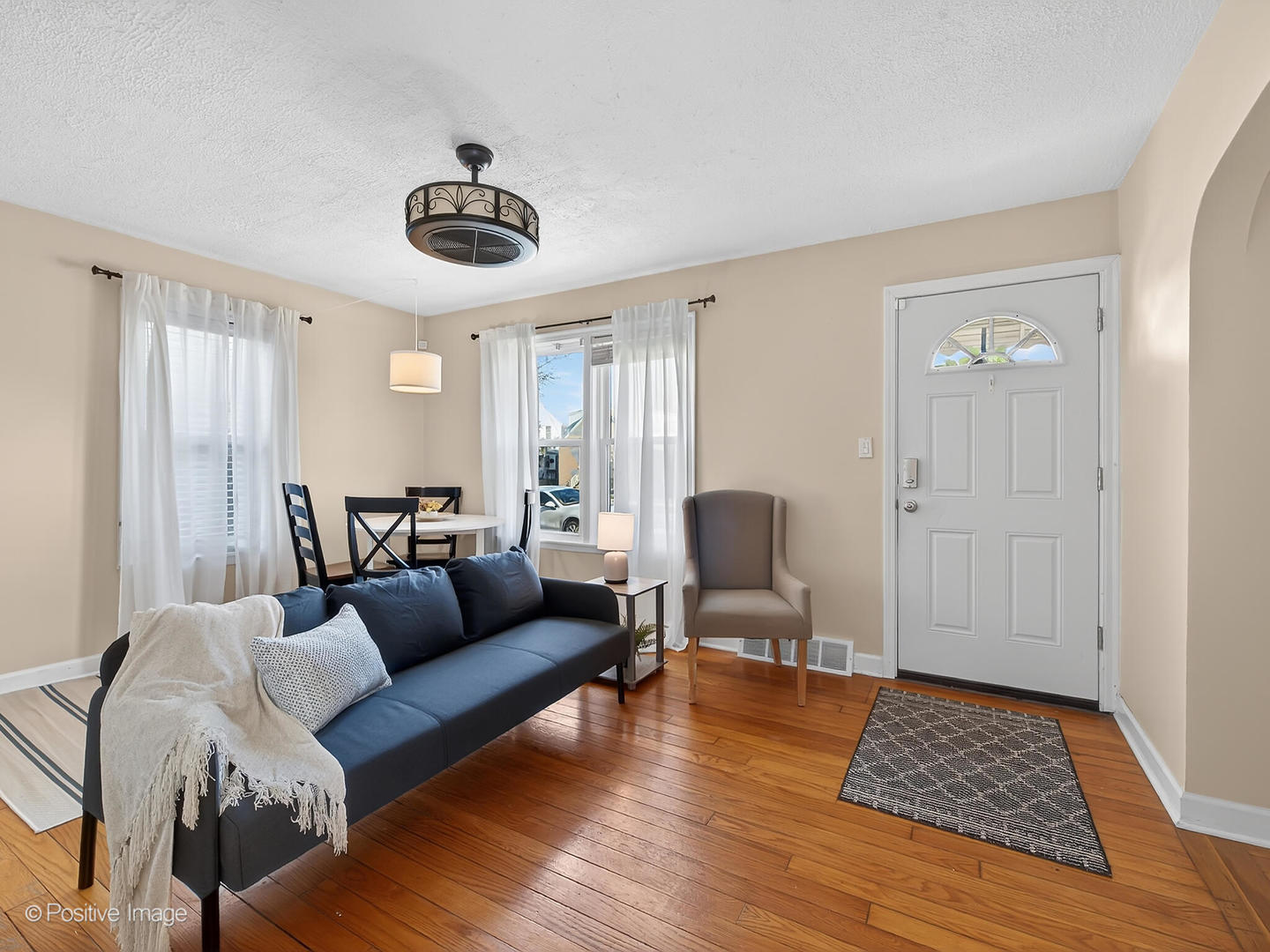 4214 Prairie Avenue Brookfield, IL 60513 - Photo 4 of 19 a living room with furniture and a rug