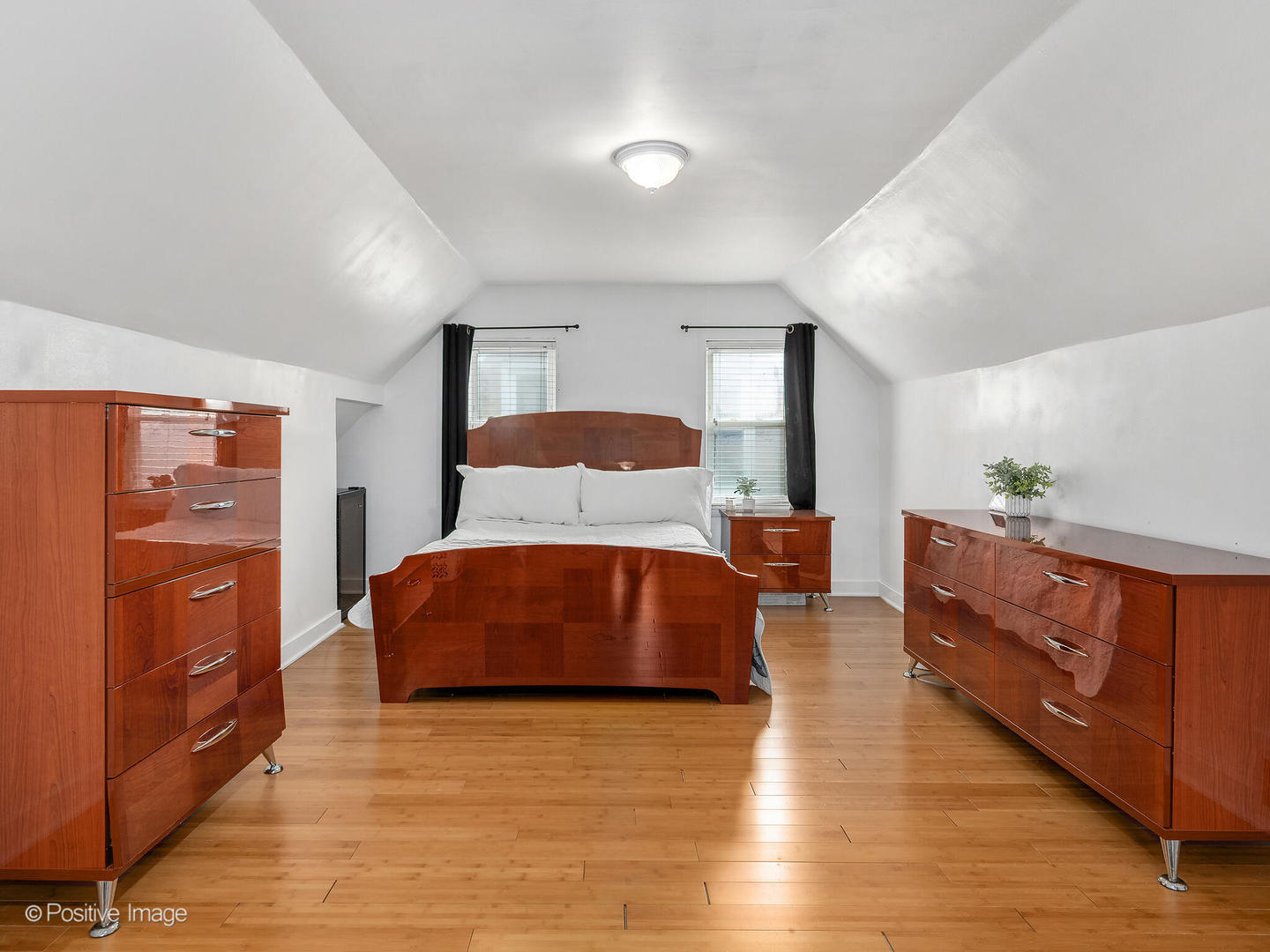4214 Prairie Avenue Brookfield, IL 60513 - Photo 8 of 19 a bedroom with a bed and wooden floor