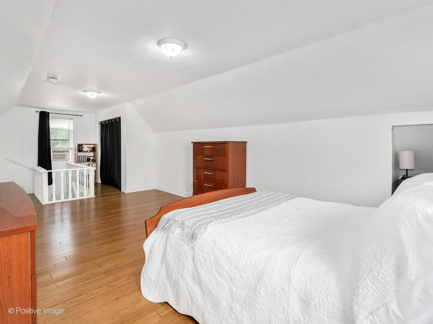 4214 Prairie Avenue Brookfield, IL 60513 - Photo 9 of 19 a bedroom with a bed and wooden floor