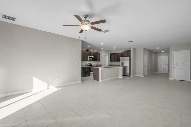 a view of a kitchen with a sink and cabinet