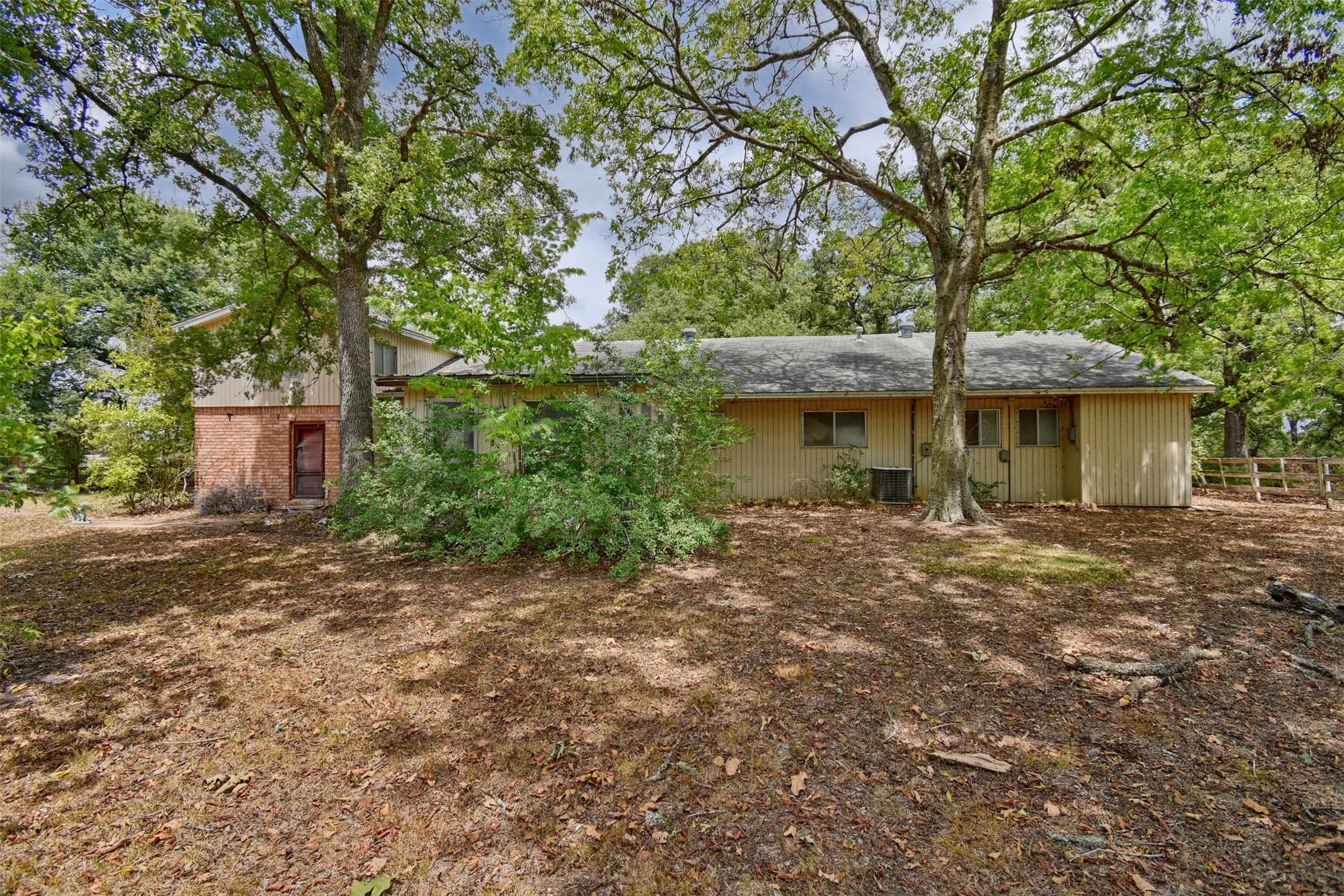 3775 Old Gay Hill Road Brenham, TX 77833 - Photo 8 of 13 a front view of a house with a garden