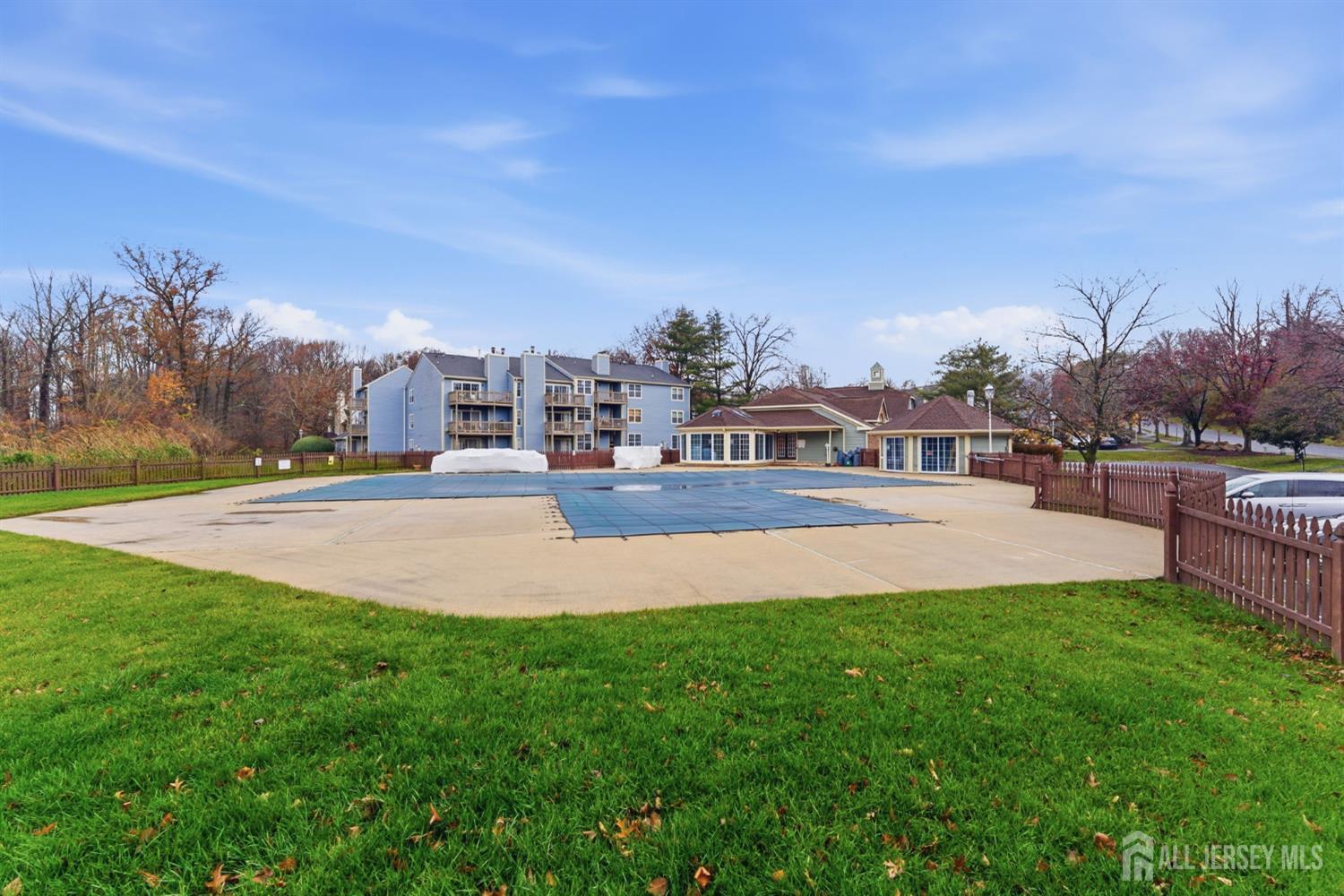 3242 Cypress Court Monmouth Junction, NJ 08852 - Photo 17 of 25 a view of yard with swimming pool and trees