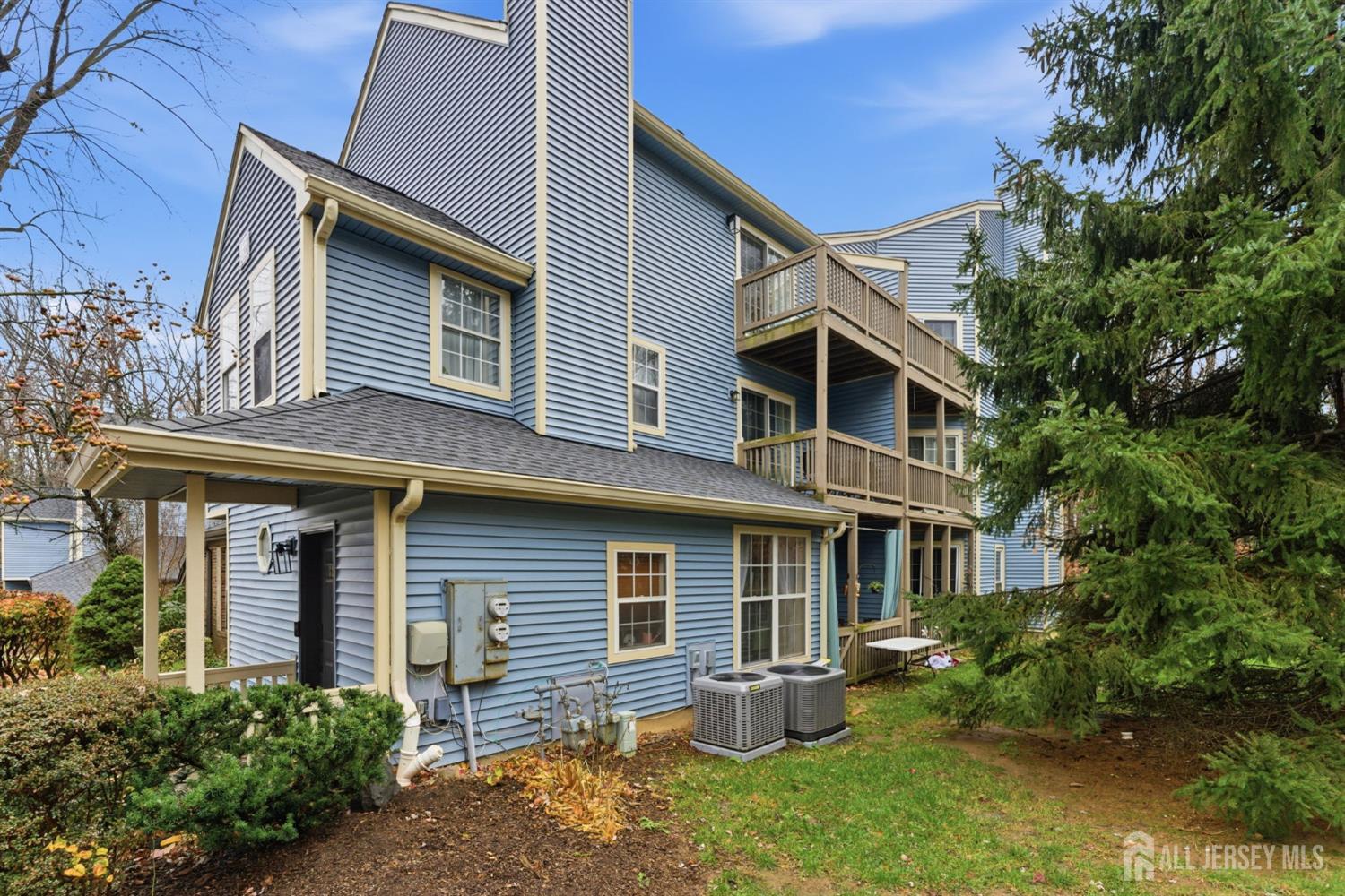 3242 Cypress Court Monmouth Junction, NJ 08852 - Photo 2 of 25 a front view of a house with a yard