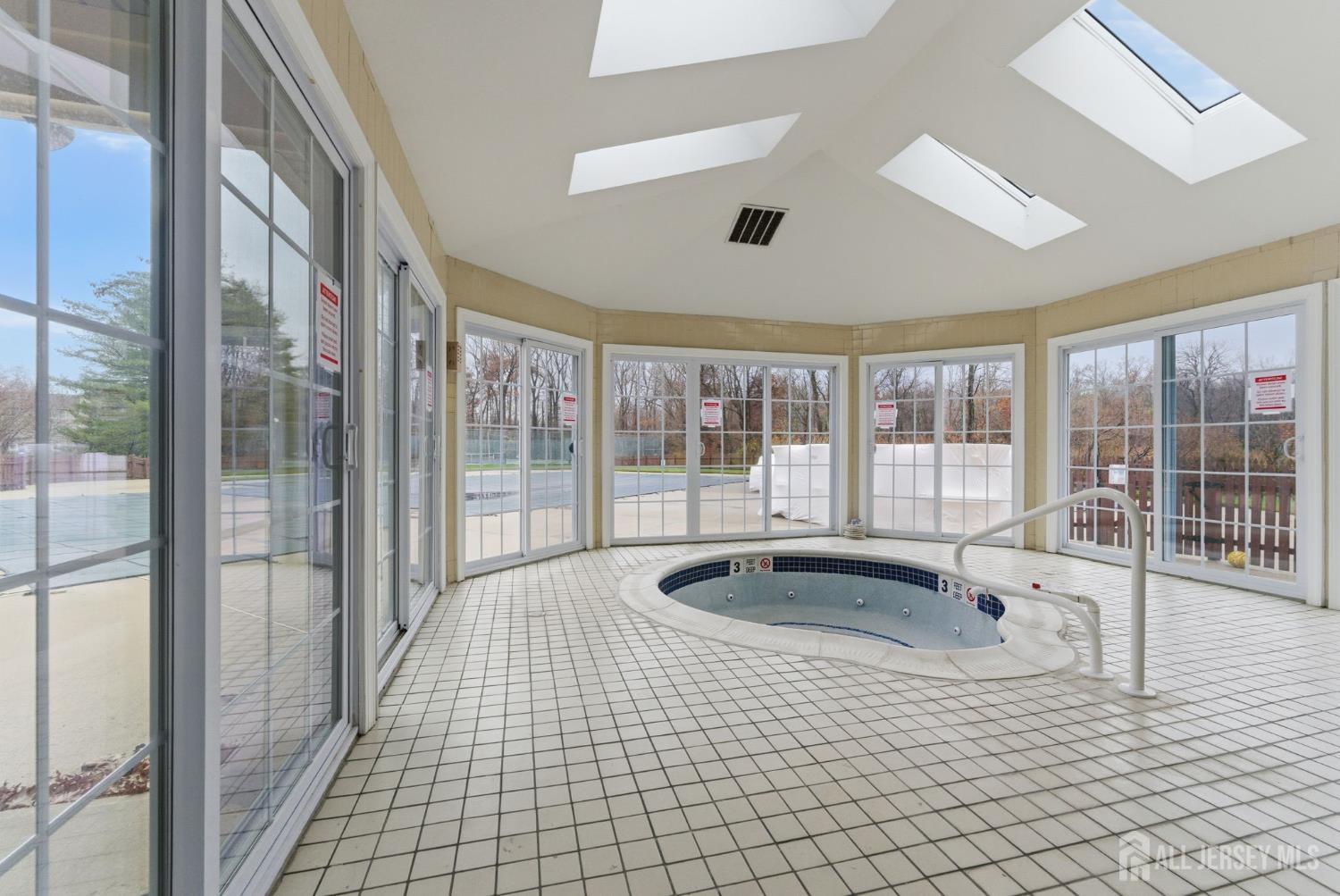 3242 Cypress Court Monmouth Junction, NJ 08852 - Photo 23 of 25 a bathroom with a tub and large window