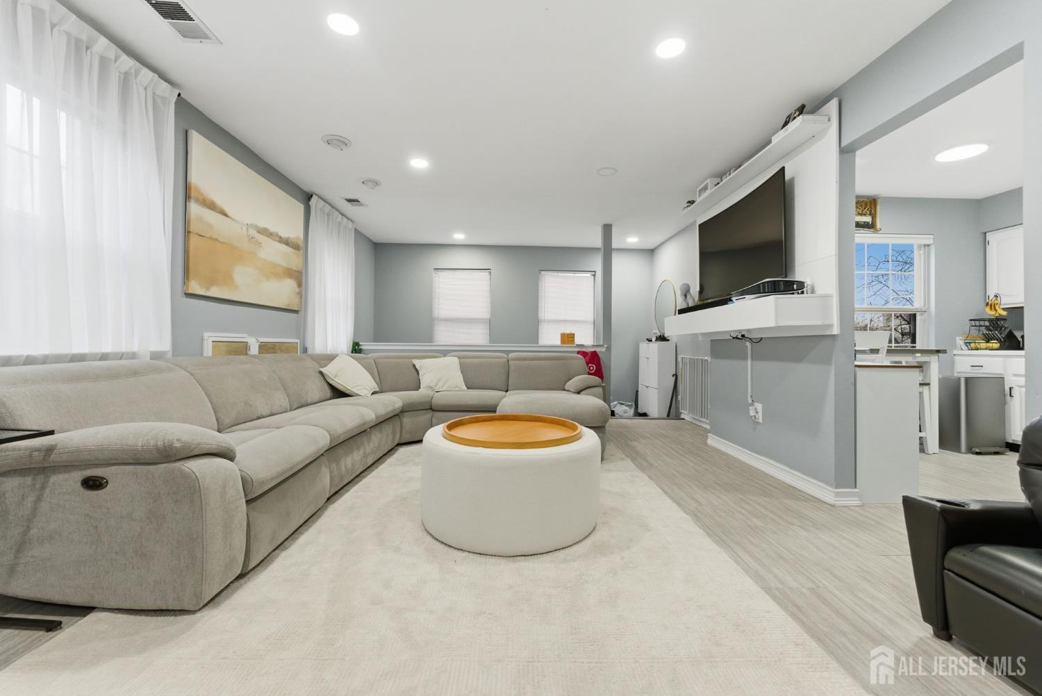 3242 Cypress Court Monmouth Junction, NJ 08852 - Photo 5 of 25 a living room with furniture and a flat screen tv