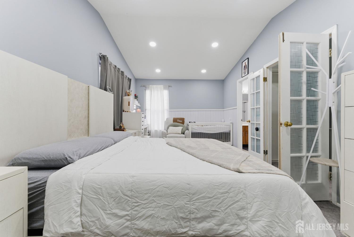 3242 Cypress Court Monmouth Junction, NJ 08852 - Photo 9 of 25 a spacious bedroom with a bed and a large mirror