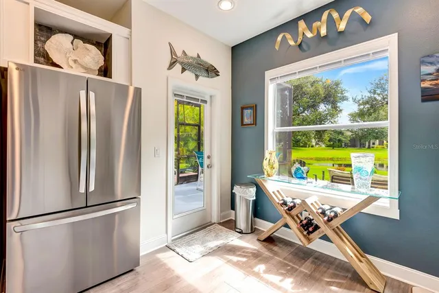 a bedroom with a bed and painting on the wall
