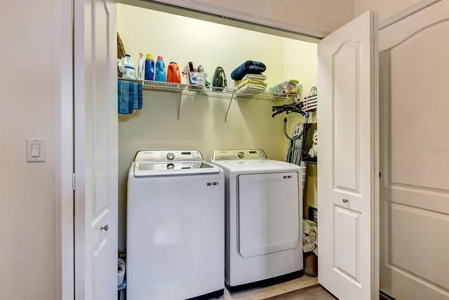 a bathroom with a granite countertop toilet a sink and a mirror