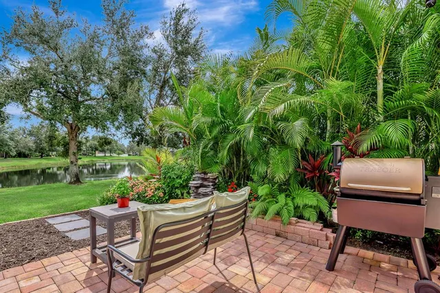 a view of a chair and table in front of house