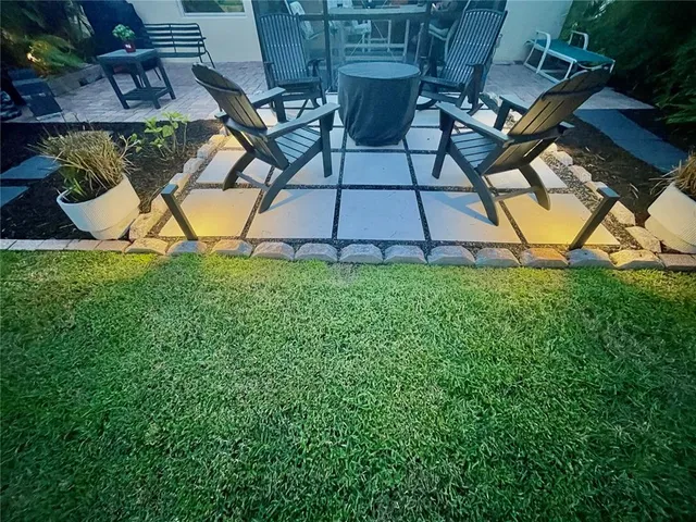 an outdoor sitting area with golf course