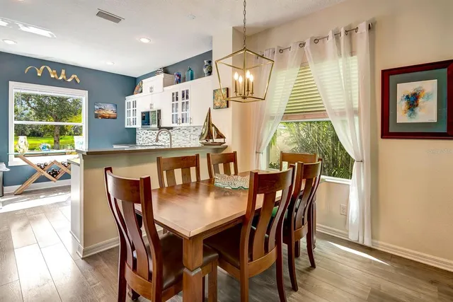 a dining room with furniture and window