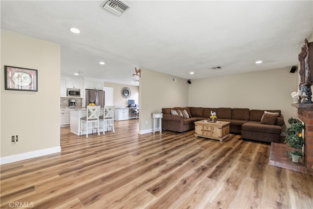27816 Ridgegrove Drive Saugus, CA 91350 - Photo 22 of 65 a living room with furniture and a wooden floor