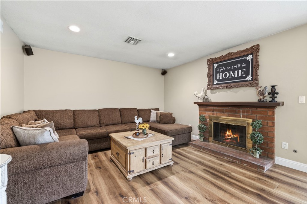 27816 Ridgegrove Drive Saugus, CA 91350 - Photo 25 of 65 a living room with furniture and a fireplace