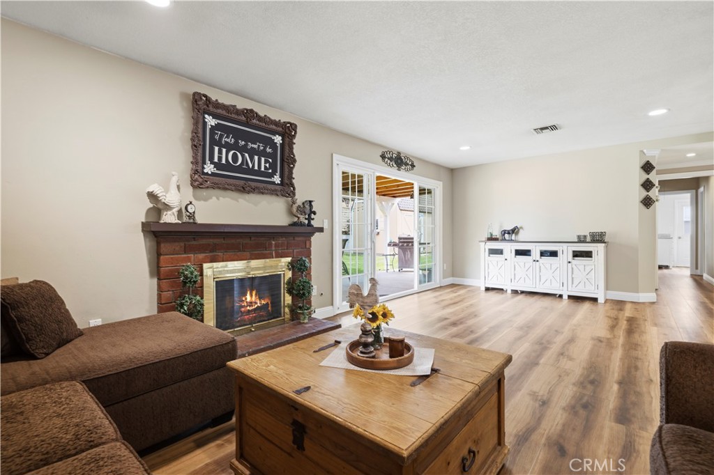27816 Ridgegrove Drive Saugus, CA 91350 - Photo 27 of 65 a living room with furniture and a fireplace