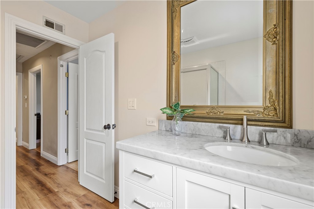 27816 Ridgegrove Drive Saugus, CA 91350 - Photo 36 of 65 a bathroom with a sink and a mirror