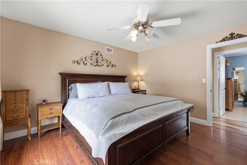 27816 Ridgegrove Drive Saugus, CA 91350 - Photo 39 of 65 a bedroom with a bed and a chandelier