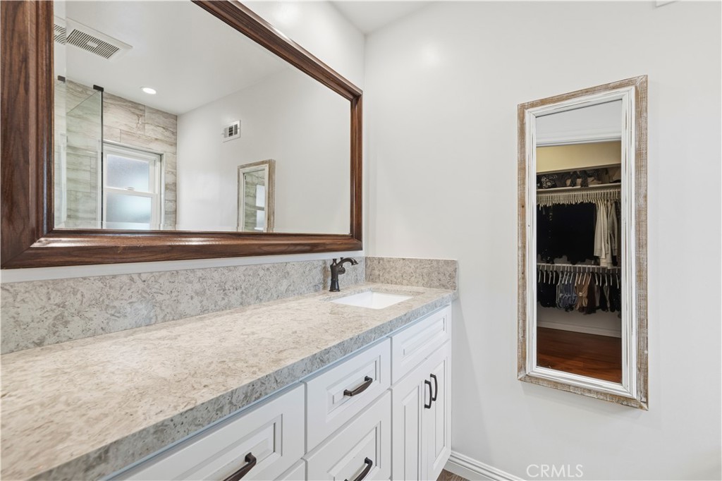 27816 Ridgegrove Drive Saugus, CA 91350 - Photo 43 of 65 a bathroom with a sink and a mirror