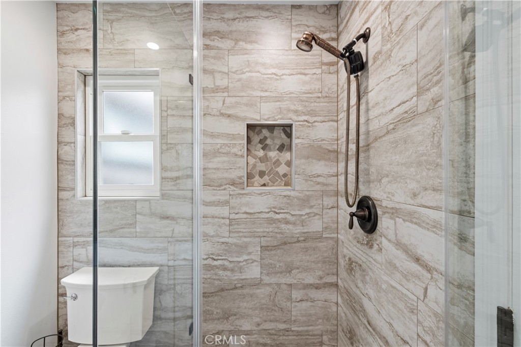 27816 Ridgegrove Drive Saugus, CA 91350 - Photo 44 of 65 a bathroom with a shower and toilet