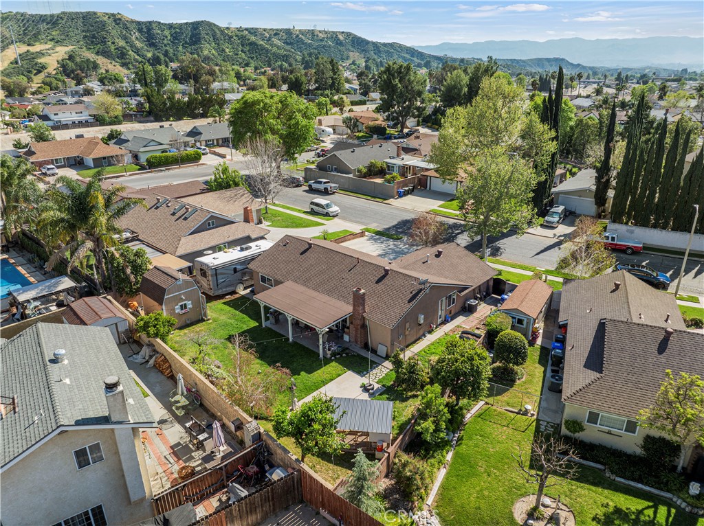 27816 Ridgegrove Drive Saugus, CA 91350 - Photo 60 of 65 an aerial view of a city with lots of residential buildings and mountain view in back