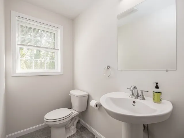 a white sink sitting next to a white toilet