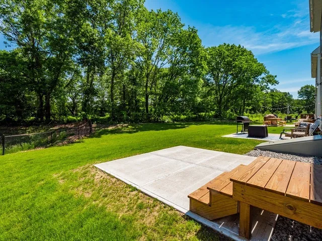 a view of a backyard with sitting area