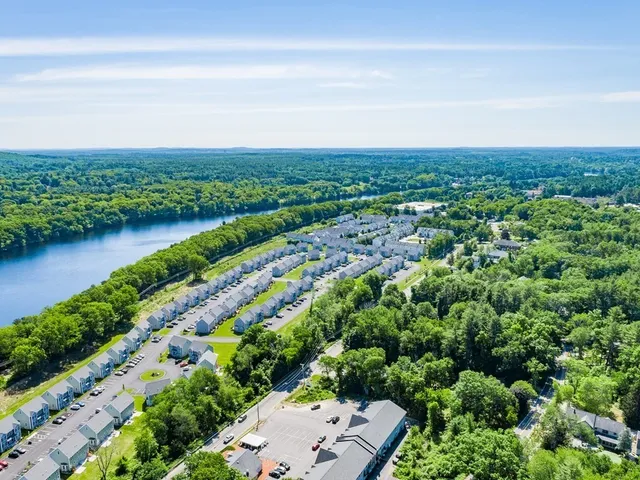 an aerial view of a city and lake view