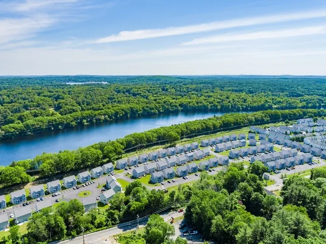 a view of a city with a lake
