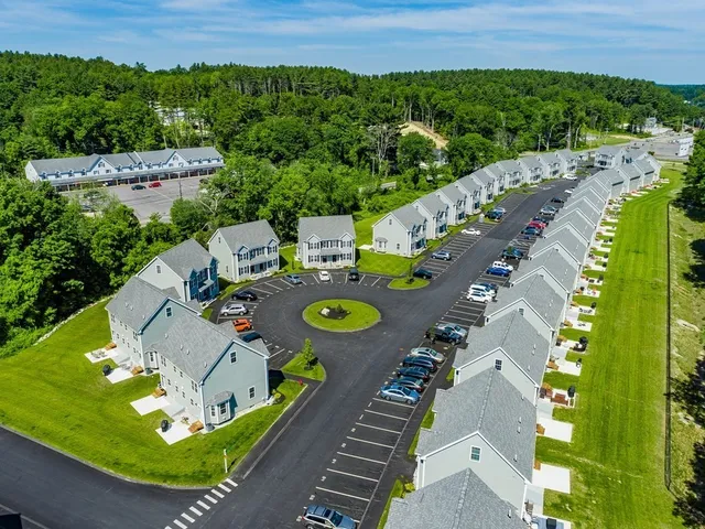 an aerial view of a house with outdoor space