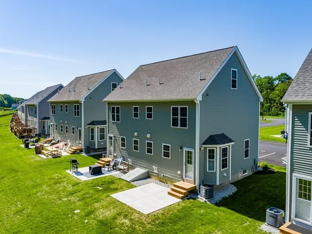 a view of a house with backyard porch and sitting area