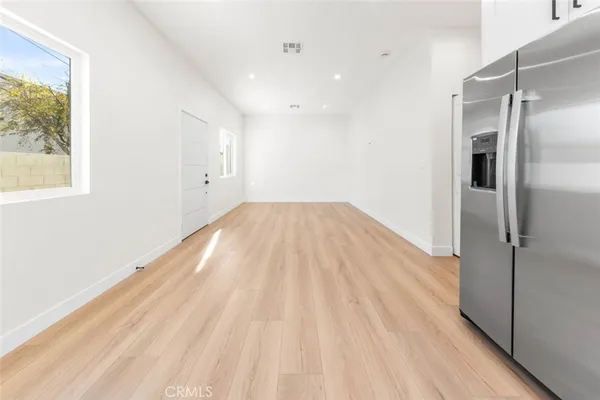a view of wooden floor in an empty room