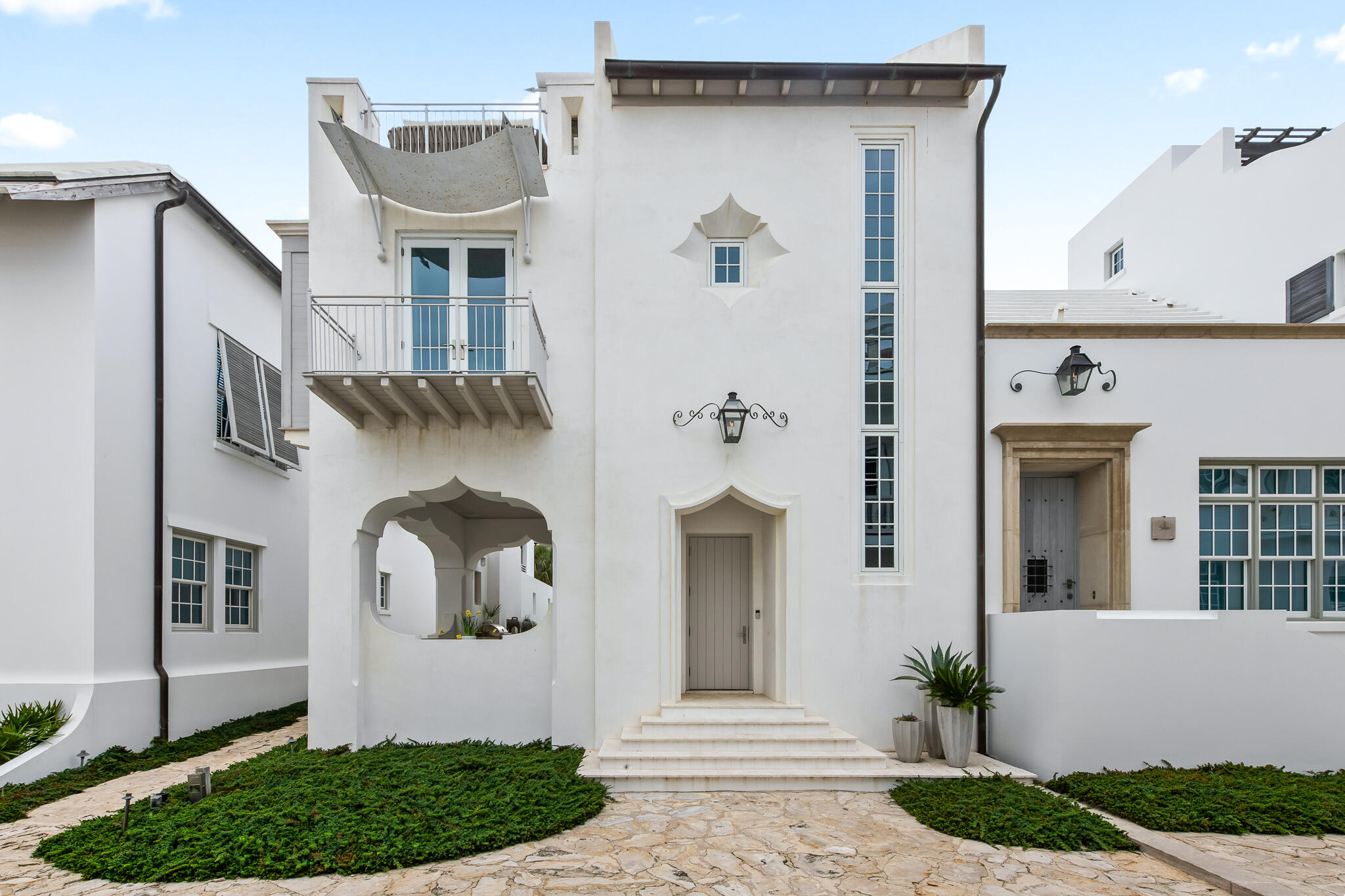 a front view of a house with garden