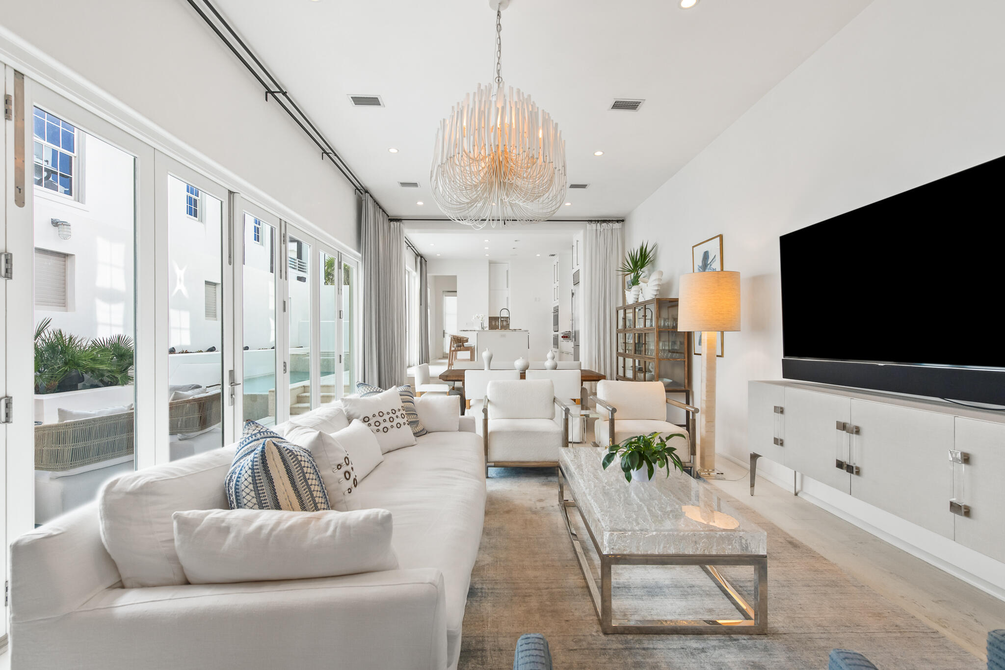 14 Shinbone Court Inlet Beach, FL 32461 - Photo 13 of 48 a living room with furniture a flat screen tv and a chandelier