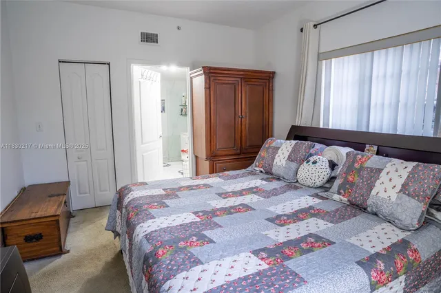 a bathroom with a sink vanity and shower