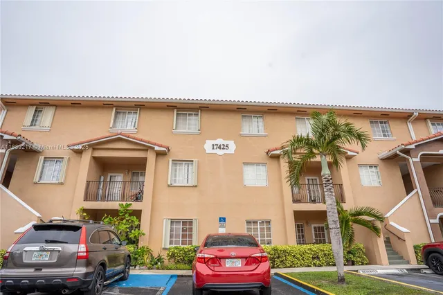 a front view of a house with parking