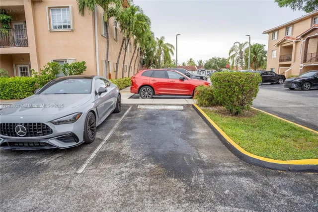a view of outdoor space with garden and signage