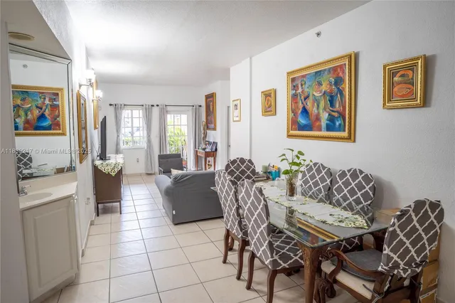 a kitchen with stainless steel appliances a stove a sink and a refrigerator