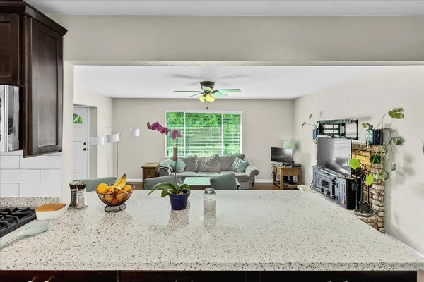 a living room with furniture window and wooden floor