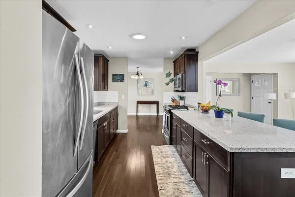 a kitchen with cabinets and stainless steel appliances