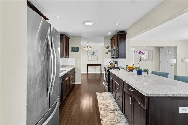 a kitchen with cabinets and stainless steel appliances