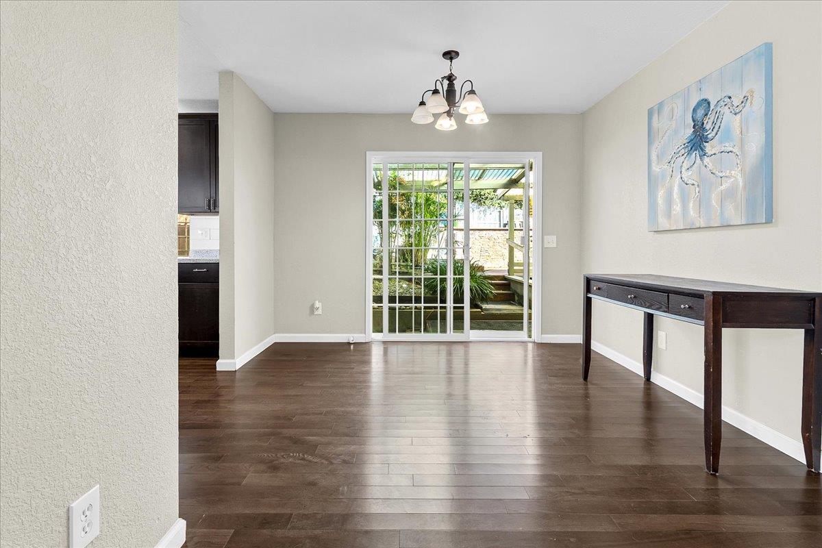 17780 Berta Canyon Road Prunedale, CA 93907 - Photo 9 of 19 a view of an empty room with wooden floor and a window