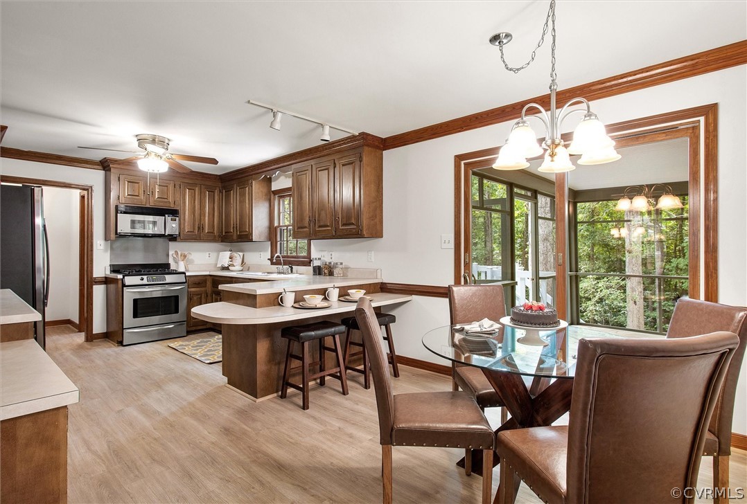 1006 Castle Hollow Road Midlothian, VA 23114 - Photo 11 of 42 a view of a dining room with furniture window and outside view