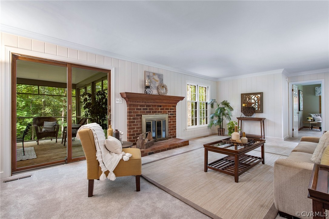 1006 Castle Hollow Road Midlothian, VA 23114 - Photo 20 of 42 a living room with furniture a fireplace and a large window
