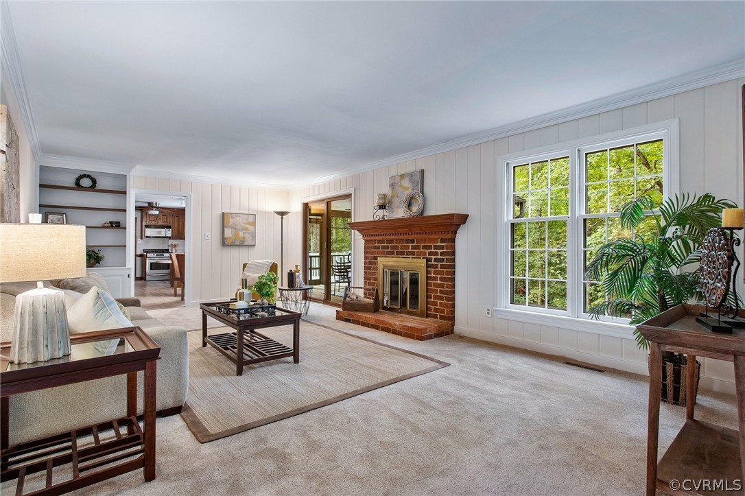 1006 Castle Hollow Road Midlothian, VA 23114 - Photo 21 of 42 a living room with furniture a fireplace and a window